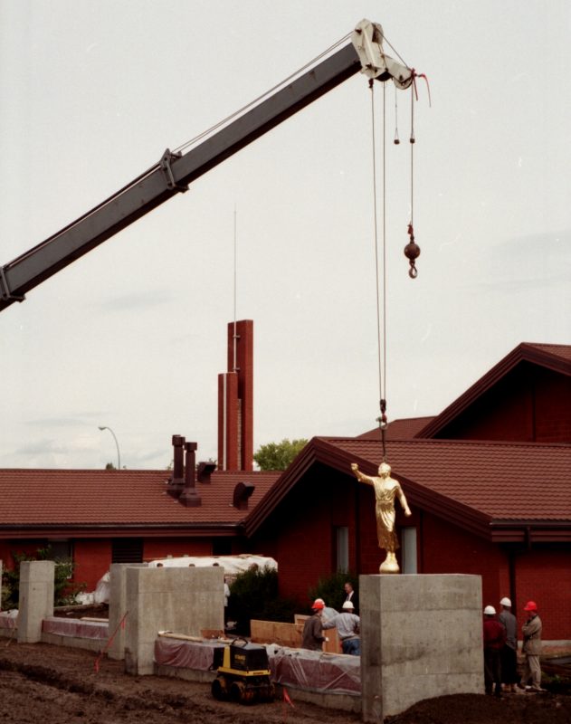 Statue emerges from packing crate.