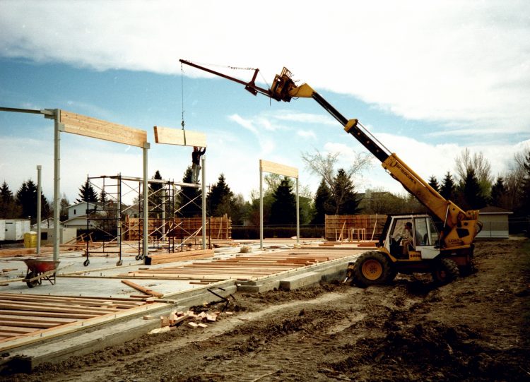 Beam hoisted atop columns.