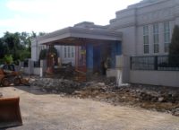 Jacks hold up the portico roof so it stays in place as the supporting columns are removed (8 Aug 2011).