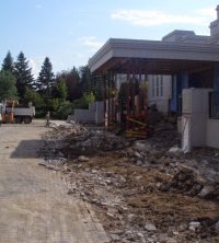 The patio bricks and remnants of the tiered garden walls are removed along with their encased rebar (8 Aug 2011).