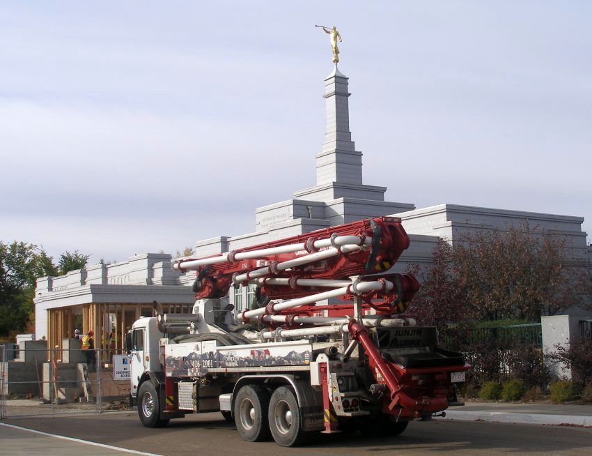 The concrete pumping truck arrives.