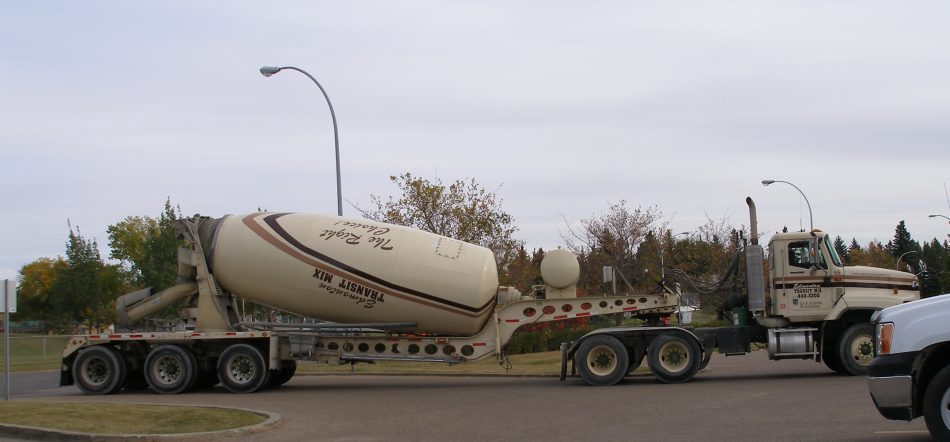 The concrete arrives right on schedule. Count 'em: five load-carrying axles.