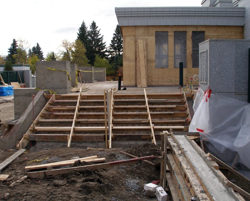 The planter wall North of the stairs has also been poured (foreground, right).