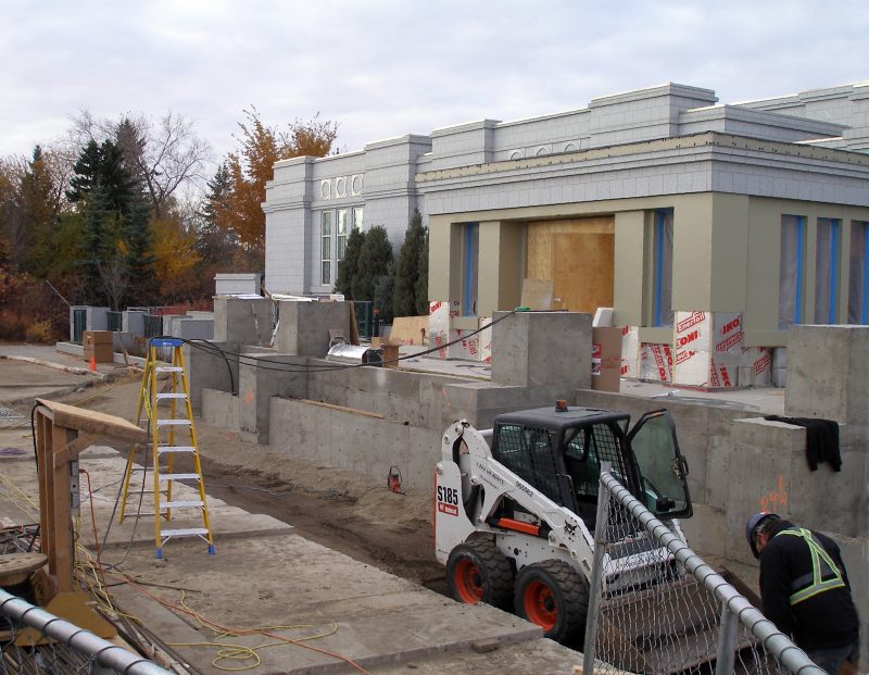 The roadbed foundation is leveled and the portico exterior sheeting has largely been installed.