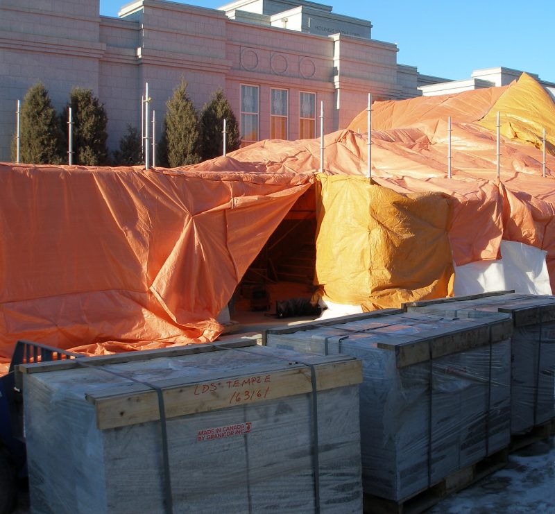 Weather protection shrouds are extended to enclose the South stairs, etc.