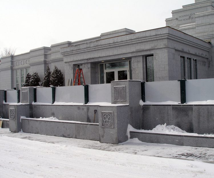 The decorative stone pieces are in place on the East wall of the platform.