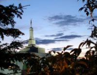 Spire with Moroni statue from Southeast roadway.